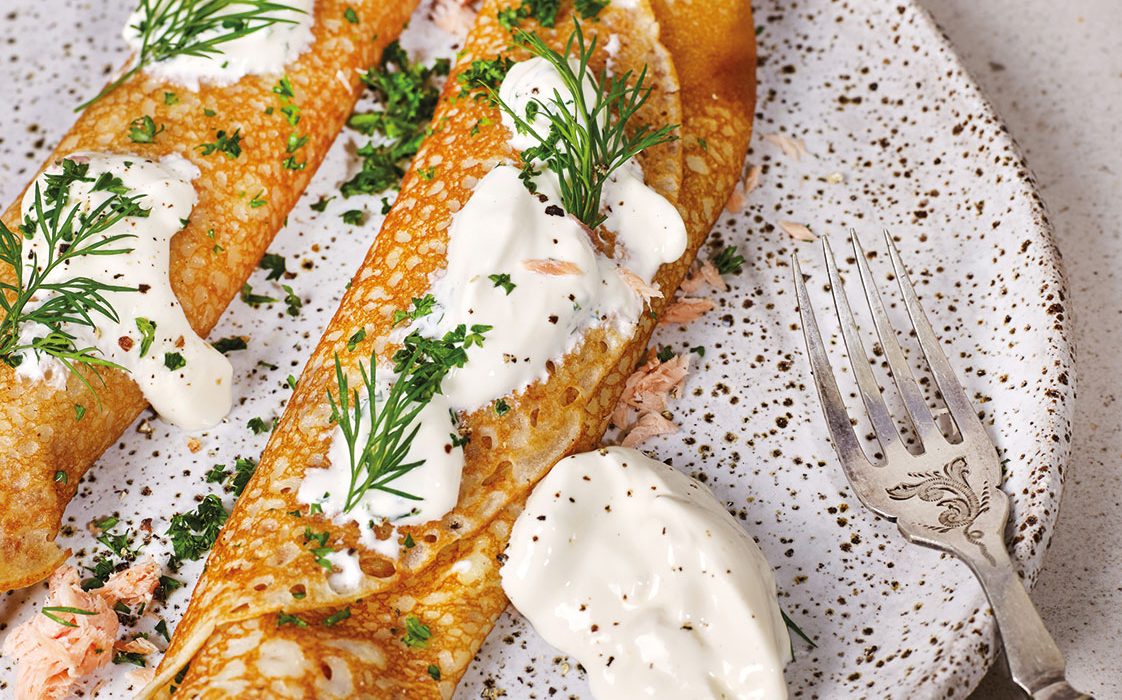 Kefir Crêpes with smoked salmon, pickled onion, sour cream and herbs